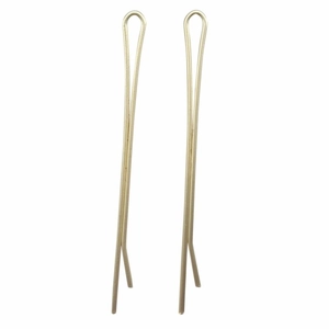 Detail of two gold metal U-shaped hair pins with smooth finish for bridal styling