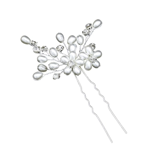 Detailed close-up of handmade bridal hair pin with pearls and rhinestones on silver wire