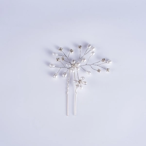 Detailed view of silver hair pin with white faux pearls and crystal flowers for bridal updos
