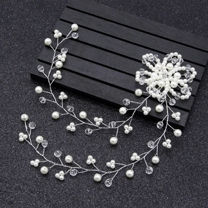 Handmade bridal hair vine with white pearls and crystals on a silver wire for weddings