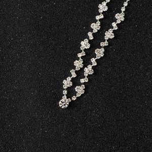 Exquisite silver bridal crystal necklace and earring set with shimmering rhinestones