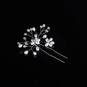 Detailed view of handmade bridal hair pin with silver wire pearls and crystals