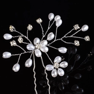Detailed view of handmade silver bridal hair pin with pearls and crystal flowers