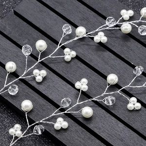 Detail of silver bridal hair vine with pearls and faceted crystals on black display