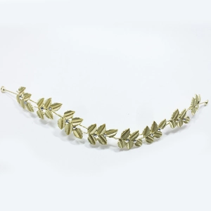 Detail showing golden metal leaves and crystal rhinestones on the wedding bridal hair vine