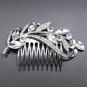Silver bridal hair comb with marquise rhinestones and leaf motifs on a dark background