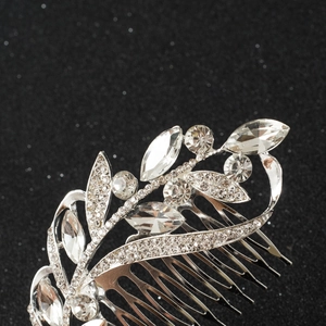 Macro shot of silver bridal hair comb featuring marquise crystals and leaves