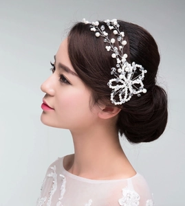 Detailed side view of handmade bridal headband with white pearls and clear crystals