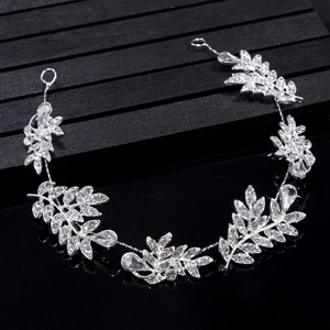 Detail of silver bridal hair vine with sparkling crystals and leaf-shaped metal design