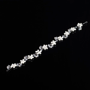 Handmade silver bridal headband with pearls and crystal flowers for wedding hair styling