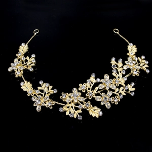 Detail of bridal headband featuring gold leaf motifs and sparkling crystal floral accents