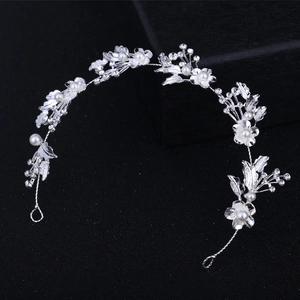 Silver bridal headband with crystal rhinestones and pearls featuring leaf and flower design