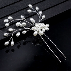 Elegant silver bridal hair pins set with handmade pearls and floral branch design