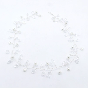 Detail view of bridal hair vine with white pearls and clear crystal beads on silver wire