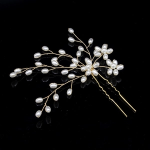 Handmade bridal hair pin with golden wire flower branches and elegant white pearls