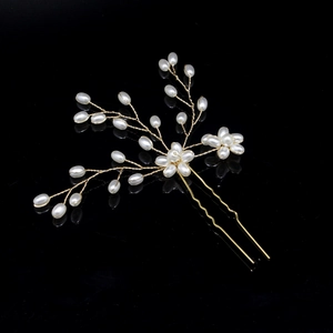 Handmade bridal hair pin with white pearls and golden wire branches for wedding hairstyles