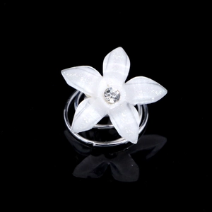White resin flower hair pin with pearls and rhinestones on a silver spiral base