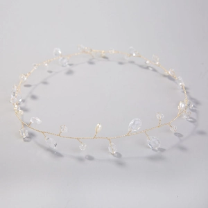 Elegant gold wire bridal headband with clear crystal beads and white pearls for weddings