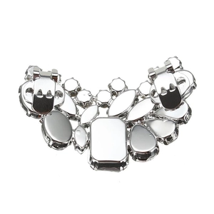 Detailed back view of bridal shoe clips with silver metal buckles and crystal settings