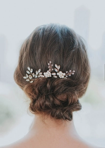 Detail of handmade bridal hair vine with white pearls and crystals on rose gold wire