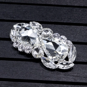 Detailed macro view of large cluster crystal shoe clips with teardrop and marquise gems