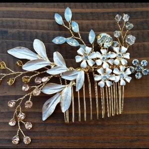 Detail of bridal hair comb with gold wire, white flowers, and rhinestone accents