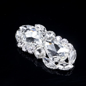 Detailed close-up of luxury bridal shoe clips with sparkling crystal rhinestones in silver