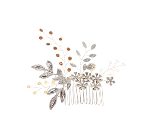 Detailed close-up of a handmade bridal hair comb with silver leaves and amber crystals