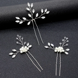 Elegant bridal hair pins set with pearls and rhinestones on silver wire branches