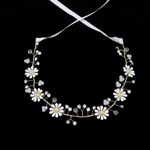 Handmade bridal headband with white daisies, crystals and gold wire on black background