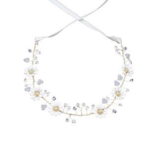 Handmade golden bridal headband with white daisies and crystal beads on white background
