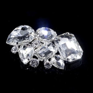 Macro shot of silver detachable bridal shoe clips with sparkling crystal rhinestones