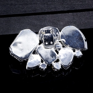 Detailed back view of silver shoe clip showing the spring buckle and crystal settings