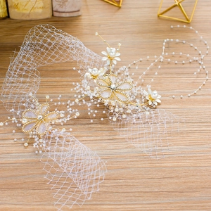 Elegant bridal floral headband with white mesh pearls and rhinestones on wood background