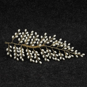 Handmade bridal hair comb with gold leaves and white pearls for wedding hairstyles