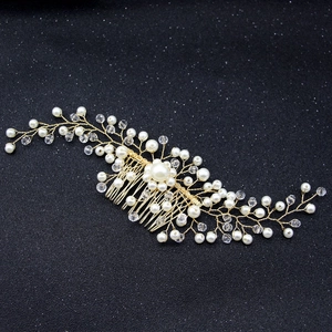 Exquisite bridal hair comb with gold wire, white pearls and sparkling crystal rhinestones