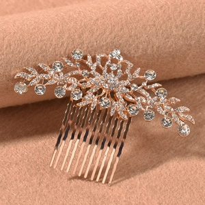 Detail of rose gold flower hair comb with sparkling crystals for bridal hairstyles