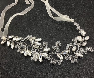 Detail of silver bridal hair vine with marquise rhinestones and white organza ribbons