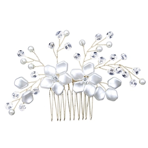 Detail of white pearl bridal hair comb with gold wire branches and crystals