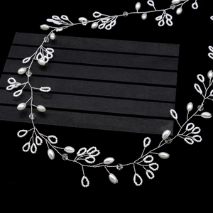 Elegant 1m long bridal pearl hair vine with crystal beads on a dark background