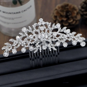 Silver bridal hair comb with glittering rhinestones and floral vine design for weddings