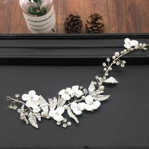 Elegant bridal hair vine with white flowers, faux pearls and crystals on a silver wire