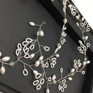 Detail showing handmade freshwater pearls and crystal beads on a 1m bridal headband