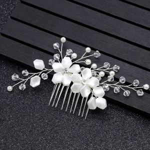 Elegant silver bridal hair comb with white pearls, crystal beads and floral motifs