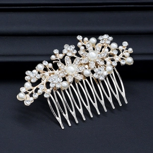 Elegant bridal hair comb with pearls and crystals in gold finish flower design