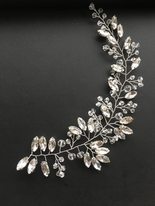 Macro view of silver bridal hair vine with sparkling marquise crystals and twisted wire detail