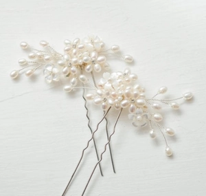 Detailed macro view of handmade pearl floral hair pin set with rhinestones and u-shape base