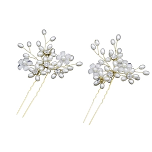 Elegant gold bridal hair pins with white flowers and pearls for wedding hairstyles