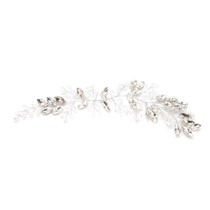 Detailed view of handmade silver vine bridal headpiece with marquise crystals