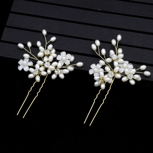 Elegant gold U-shaped bridal hair pins with white pearls and sparkling crystal flowers